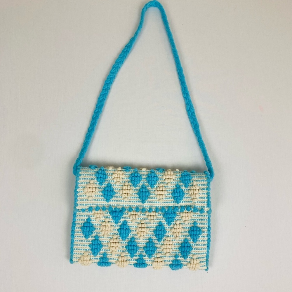 Antonello Tedde blue and white boho textured purse with braided strap.